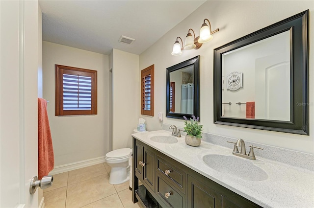 133 Tucker Ave, Sarasota, FL 34232 - bathroom with double vanity and tile patterned floors