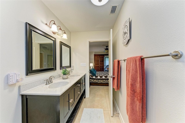 133 Tucker Ave, Sarasota, FL 34232 - bathroom featuring ensuite bath, double vanity, and tile patterned floors