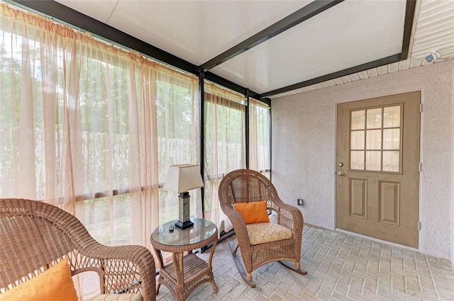 133 Tucker Ave, Sarasota, FL 34232 - sunroom with a textured wall, brick patterned floors, and healthy amount of natural light
