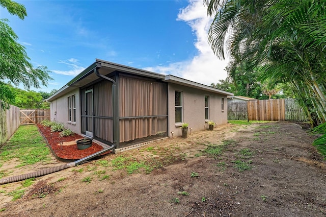 133 Tucker Ave, Sarasota, FL 34232 - view of property exterior with a fenced backyard and stucco siding