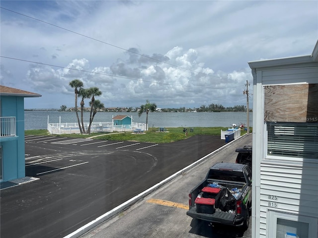 611 Gulf Dr N Unit B24, Bradenton Beach, FL 34217 - uncovered parking lot featuring a water view