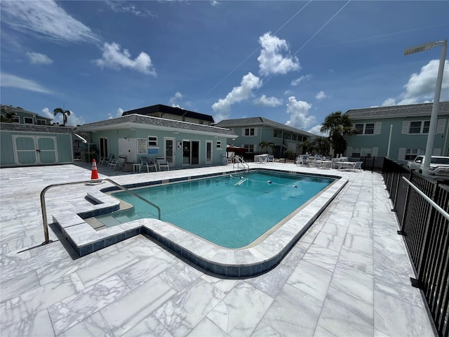 611 Gulf Dr N Unit B24, Bradenton Beach, FL 34217 - community pool with a patio area and a storage shed