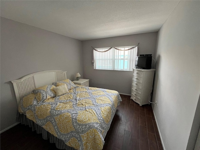 611 Gulf Dr N Unit B24, Bradenton Beach, FL 34217 - bedroom featuring baseboards and wood finished floors