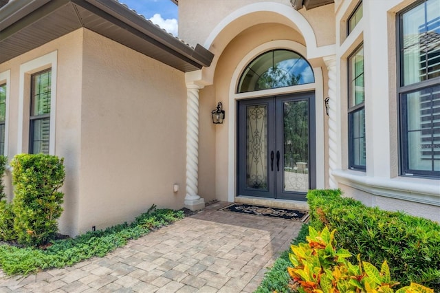 14611 Leopard Creek Pl, Lakewood Ranch, FL 34202 - entrance to property featuring french doors and stucco siding