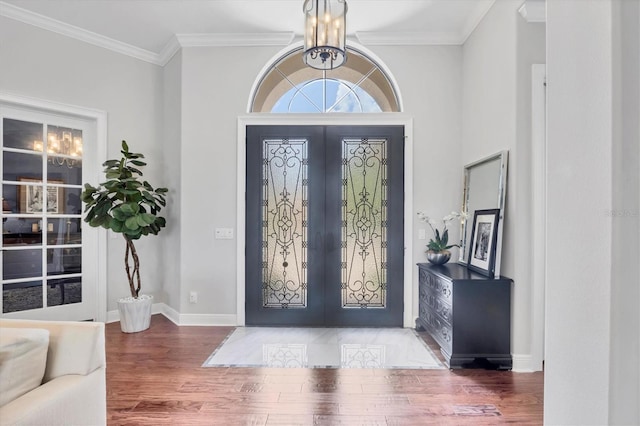 14611 Leopard Creek Pl, Lakewood Ranch, FL 34202 - foyer entrance featuring french doors, wood finished floors, and crown molding