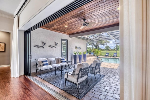 14611 Leopard Creek Pl, Lakewood Ranch, FL 34202 - view of patio / terrace with outdoor lounge area, a ceiling fan, an outdoor pool, and a lanai