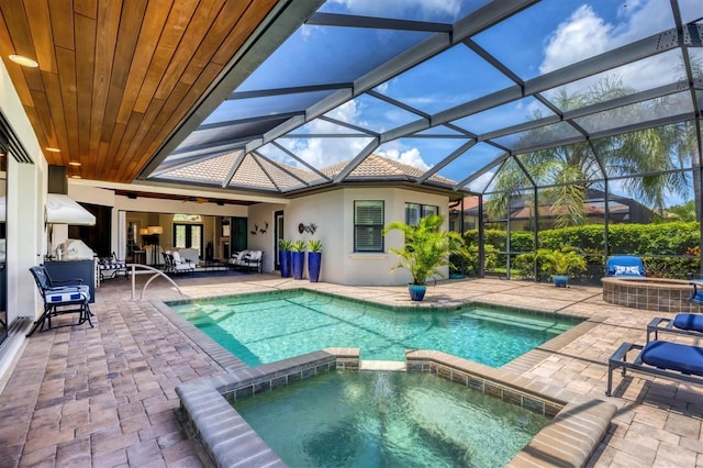 14611 Leopard Creek Pl, Lakewood Ranch, FL 34202 - view of pool with a pool with connected hot tub, a patio area, ceiling fan, and a lanai