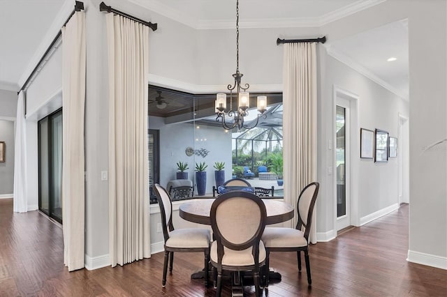 14611 Leopard Creek Pl, Lakewood Ranch, FL 34202 - dining room featuring wood finished floors, crown molding, and a chandelier