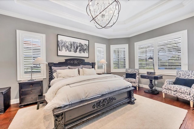 14611 Leopard Creek Pl, Lakewood Ranch, FL 34202 - bedroom featuring a raised ceiling, a chandelier, crown molding, and wood finished floors
