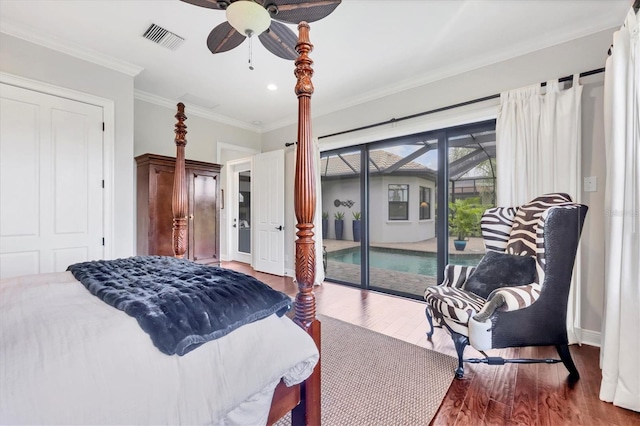 14611 Leopard Creek Pl, Lakewood Ranch, FL 34202 - bedroom featuring access to exterior, crown molding, wood finished floors, recessed lighting, and ceiling fan