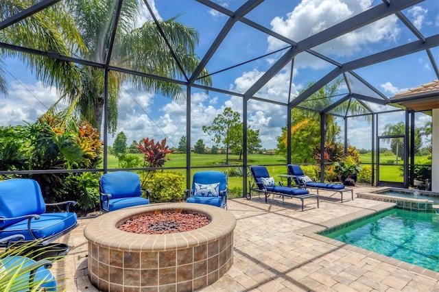 14611 Leopard Creek Pl, Lakewood Ranch, FL 34202 - view of patio featuring glass enclosure, an outdoor fire pit, and a pool with connected hot tub