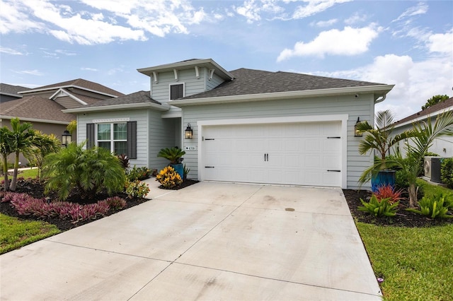 4316 Rustling Pines Ter, Parrish, FL 34219 - view of front facade featuring concrete driveway, a garage, and roof with shingles