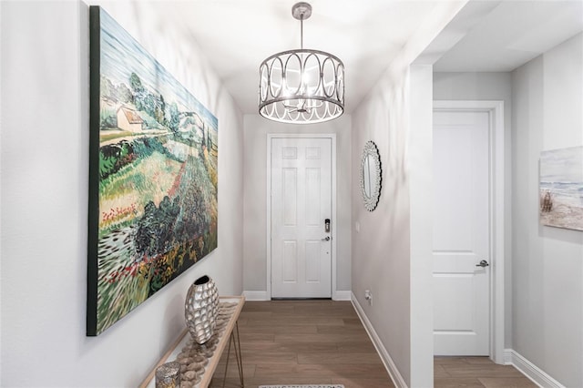4316 Rustling Pines Ter, Parrish, FL 34219 - foyer with wood finished floors and a chandelier