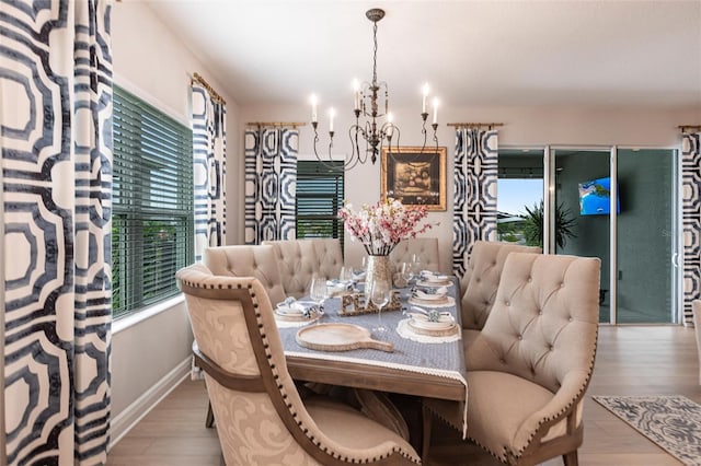 4316 Rustling Pines Ter, Parrish, FL 34219 - dining space featuring a chandelier and wood finished floors
