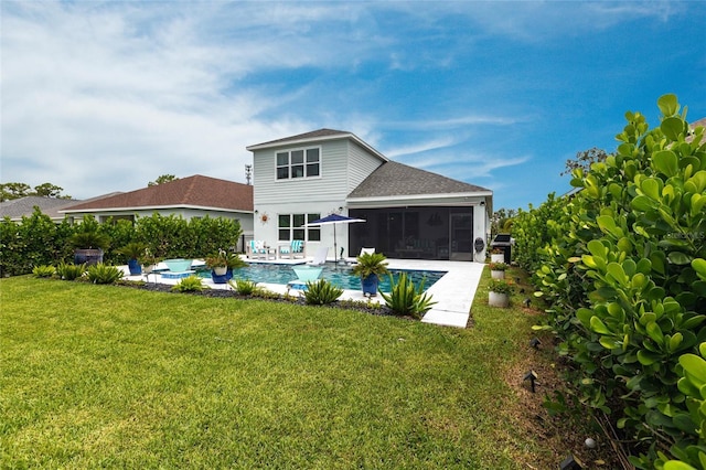 4316 Rustling Pines Ter, Parrish, FL 34219 - back of property with a sunroom, roof with shingles, a yard, and an outdoor pool