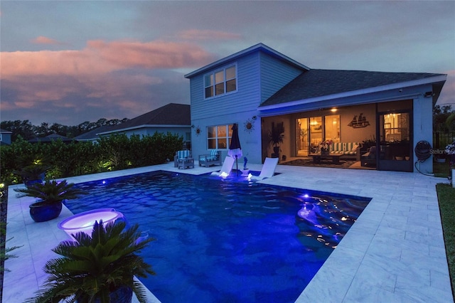 4316 Rustling Pines Ter, Parrish, FL 34219 - pool at dusk featuring a patio area and an outdoor pool