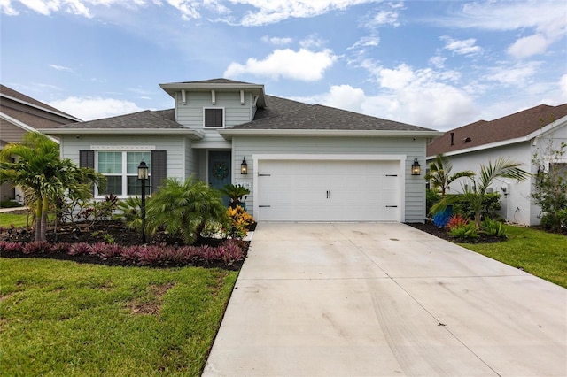 4316 Rustling Pines Ter, Parrish, FL 34219 - view of front facade featuring a garage, a front yard, concrete driveway, and roof with shingles