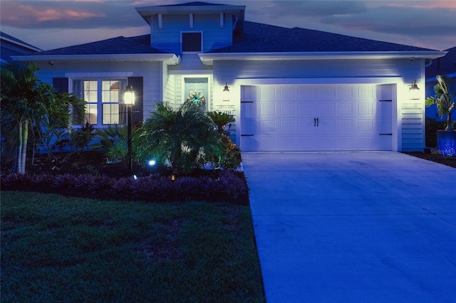 4316 Rustling Pines Ter, Parrish, FL 34219 - view of front of home featuring concrete driveway, an attached garage, and a shingled roof