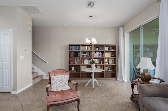 11558 84th Street Cir E Unit 106, Parrish, FL 34219 - living area featuring light tile patterned floors, stairway, and a chandelier