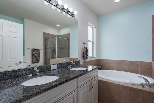 11558 84th Street Cir E Unit 106, Parrish, FL 34219 - bathroom featuring a stall shower, a garden tub, double vanity, and recessed lighting