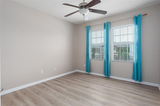11558 84th Street Cir E Unit 106, Parrish, FL 34219 - empty room featuring light wood-style floors and a ceiling fan