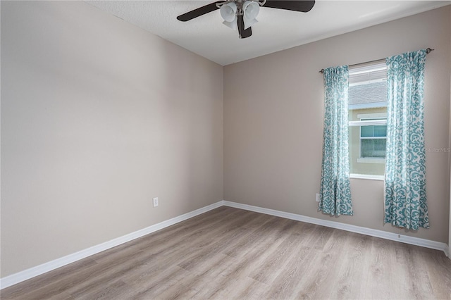 11558 84th Street Cir E Unit 106, Parrish, FL 34219 - unfurnished room featuring light wood-style floors and a ceiling fan