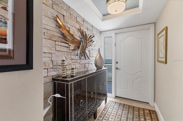 840 The Esplanade N Unit 805, Venice, FL 34285 - foyer featuring light tile patterned floors, a raised ceiling, and ornamental molding