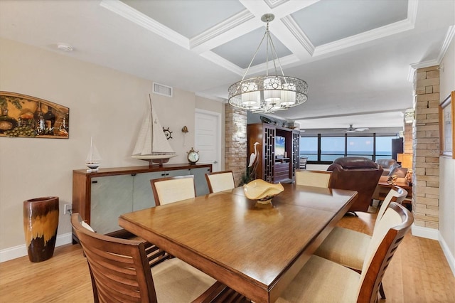840 The Esplanade N Unit 805, Venice, FL 34285 - dining room featuring light wood finished floors, a chandelier, coffered ceiling, ornate columns, and beamed ceiling
