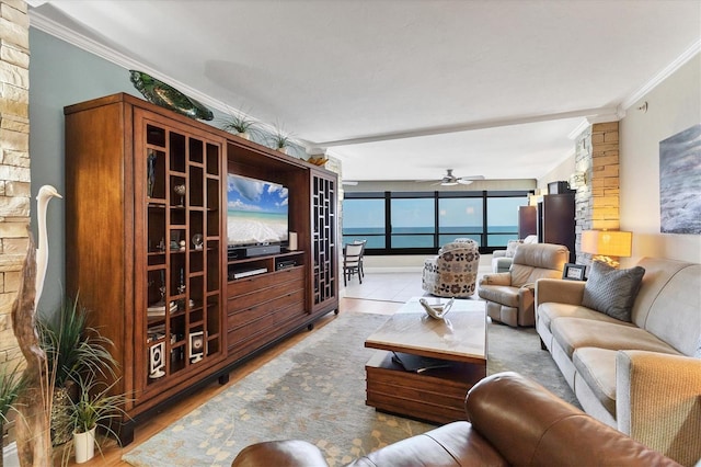 840 The Esplanade N Unit 805, Venice, FL 34285 - living room with ornamental molding, a ceiling fan, and wood finished floors