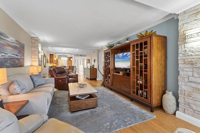 840 The Esplanade N Unit 805, Venice, FL 34285 - living area featuring wood finished floors, ornamental molding, and decorative columns