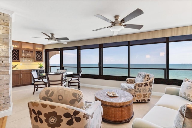 840 The Esplanade N Unit 805, Venice, FL 34285 - living area with a water view, a ceiling fan, and light tile patterned floors