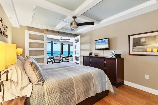 840 The Esplanade N Unit 805, Venice, FL 34285 - bedroom featuring coffered ceiling, access to exterior, light wood finished floors, beamed ceiling, and ceiling fan