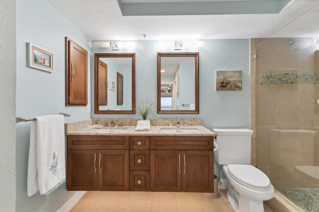 840 The Esplanade N Unit 805, Venice, FL 34285 - full bath with double vanity, tiled shower, tile patterned floors, and a textured ceiling