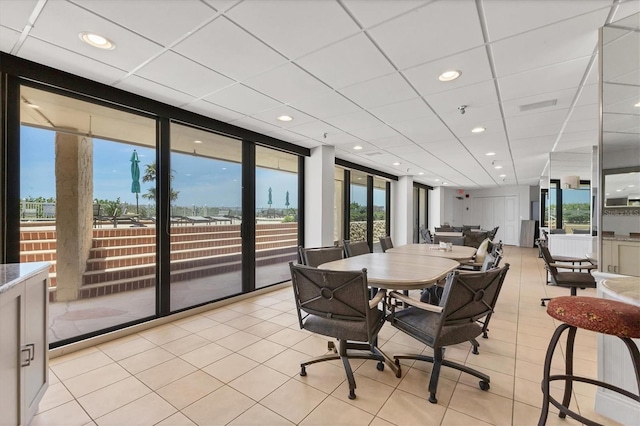 840 The Esplanade N Unit 805, Venice, FL 34285 - dining area featuring light tile patterned floors, recessed lighting, and a paneled ceiling