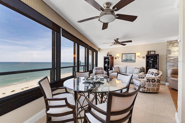 840 The Esplanade N Unit 805, Venice, FL 34285 - dining area featuring ceiling fan, a water view, and light tile patterned flooring
