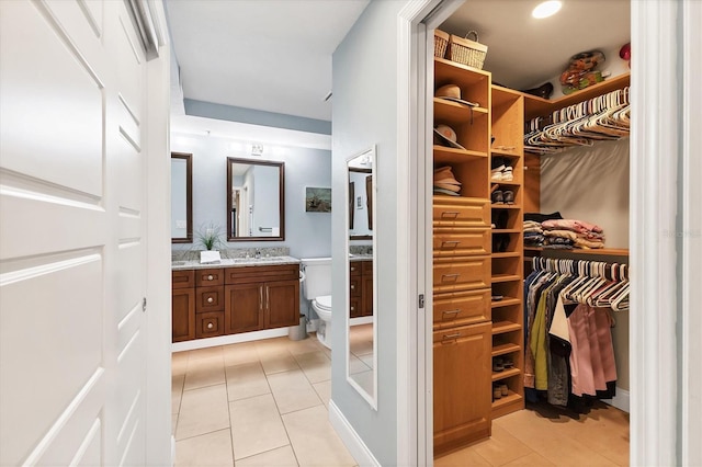 840 The Esplanade N Unit 805, Venice, FL 34285 - bathroom with vanity, tile patterned floors, and a walk in closet
