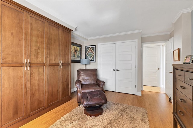 840 The Esplanade N Unit 805, Venice, FL 34285 - living area with light wood-type flooring and ornamental molding