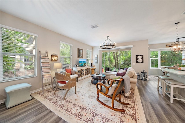 5427 Napa Dr, Sarasota, FL 34243 - living area featuring a chandelier and wood finished floors