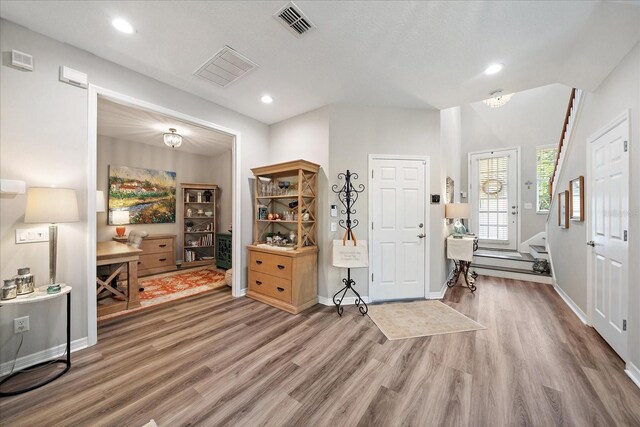 5427 Napa Dr, Sarasota, FL 34243 - entryway with wood finished floors and recessed lighting