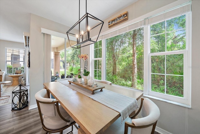 5427 Napa Dr, Sarasota, FL 34243 - dining room featuring a chandelier and wood finished floors