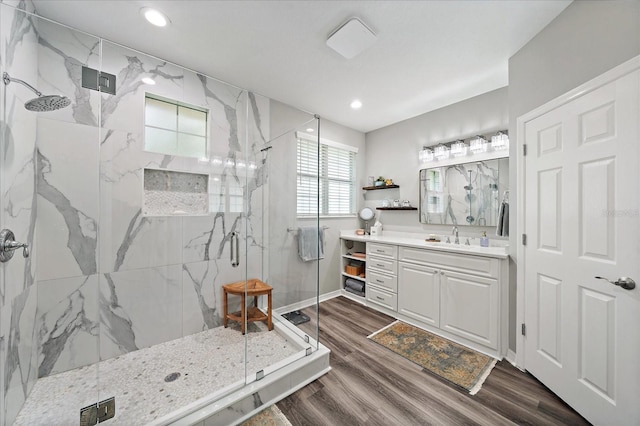 5427 Napa Dr, Sarasota, FL 34243 - full bath with a marble finish shower, vanity, wood finished floors, and recessed lighting