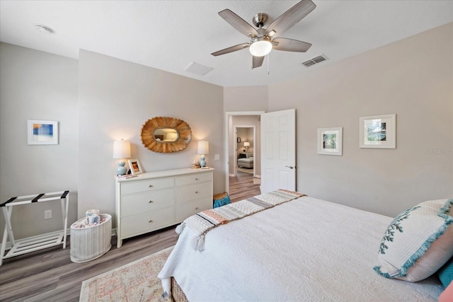 5427 Napa Dr, Sarasota, FL 34243 - bedroom featuring light wood finished floors and ceiling fan