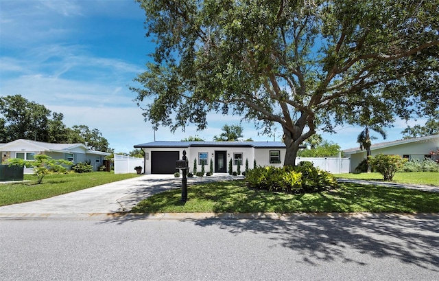 3439 Fair Oaks Pl, Sarasota, FL 34239 - single story home with concrete driveway and an attached garage