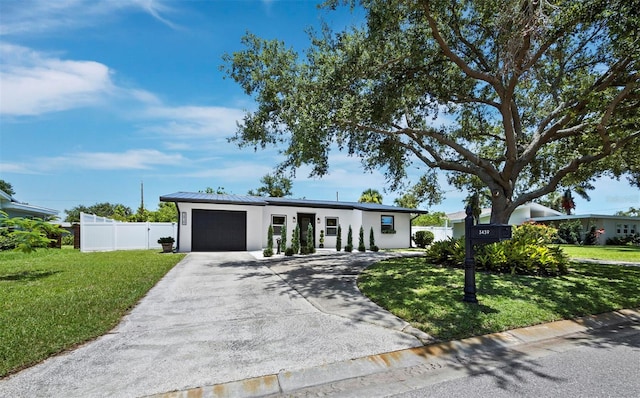 3439 Fair Oaks Pl, Sarasota, FL 34239 - mid-century home with an attached garage, stucco siding, driveway, a standing seam roof, and a metal roof