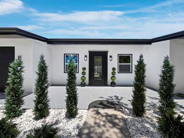 3439 Fair Oaks Pl, Sarasota, FL 34239 - doorway to property with stucco siding