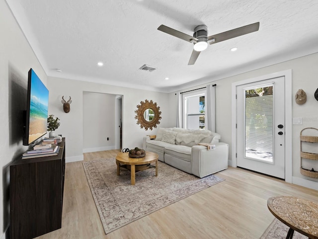 3439 Fair Oaks Pl, Sarasota, FL 34239 - living area with light wood-style flooring, ceiling fan, a textured ceiling, and recessed lighting