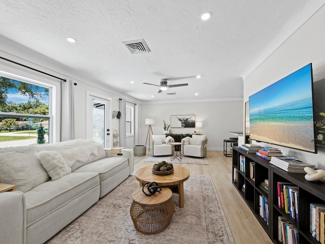 3439 Fair Oaks Pl, Sarasota, FL 34239 - living room featuring light wood-style flooring, a textured ceiling, ceiling fan, and recessed lighting