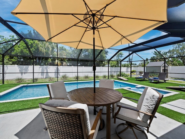 3439 Fair Oaks Pl, Sarasota, FL 34239 - view of pool with a storage unit, a fenced backyard, a patio area, and glass enclosure