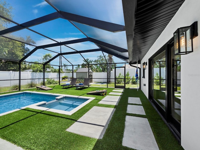 3439 Fair Oaks Pl, Sarasota, FL 34239 - view of swimming pool with a pool with connected hot tub, a fenced backyard, a lanai, a storage unit, and a patio area