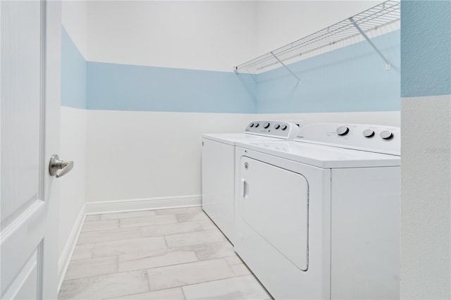 13832 Old Creek Ct, Parrish, FL 34219 - laundry room with washer and clothes dryer and light marble finish flooring